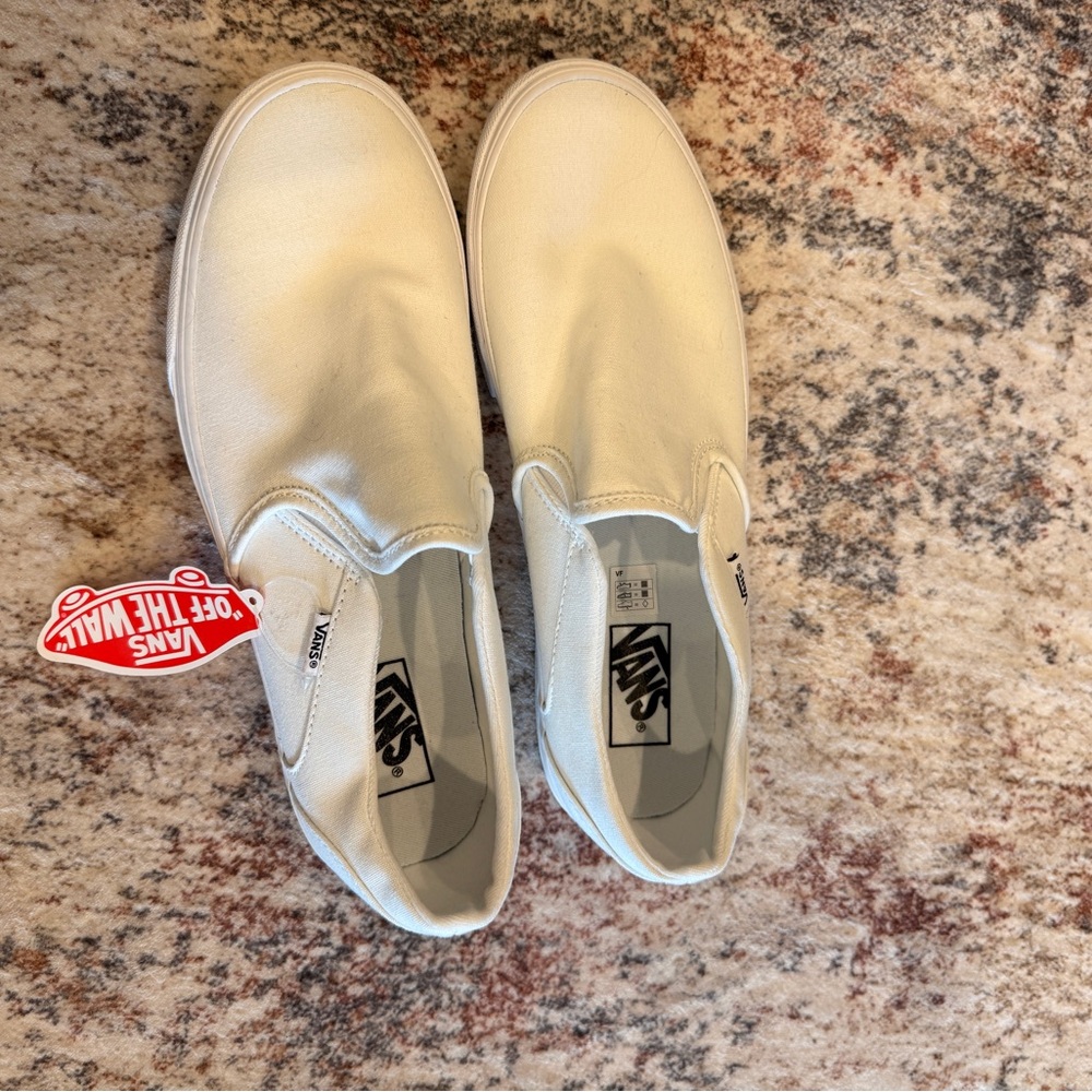 Vans women’s Classic White Slip-On Sneakers